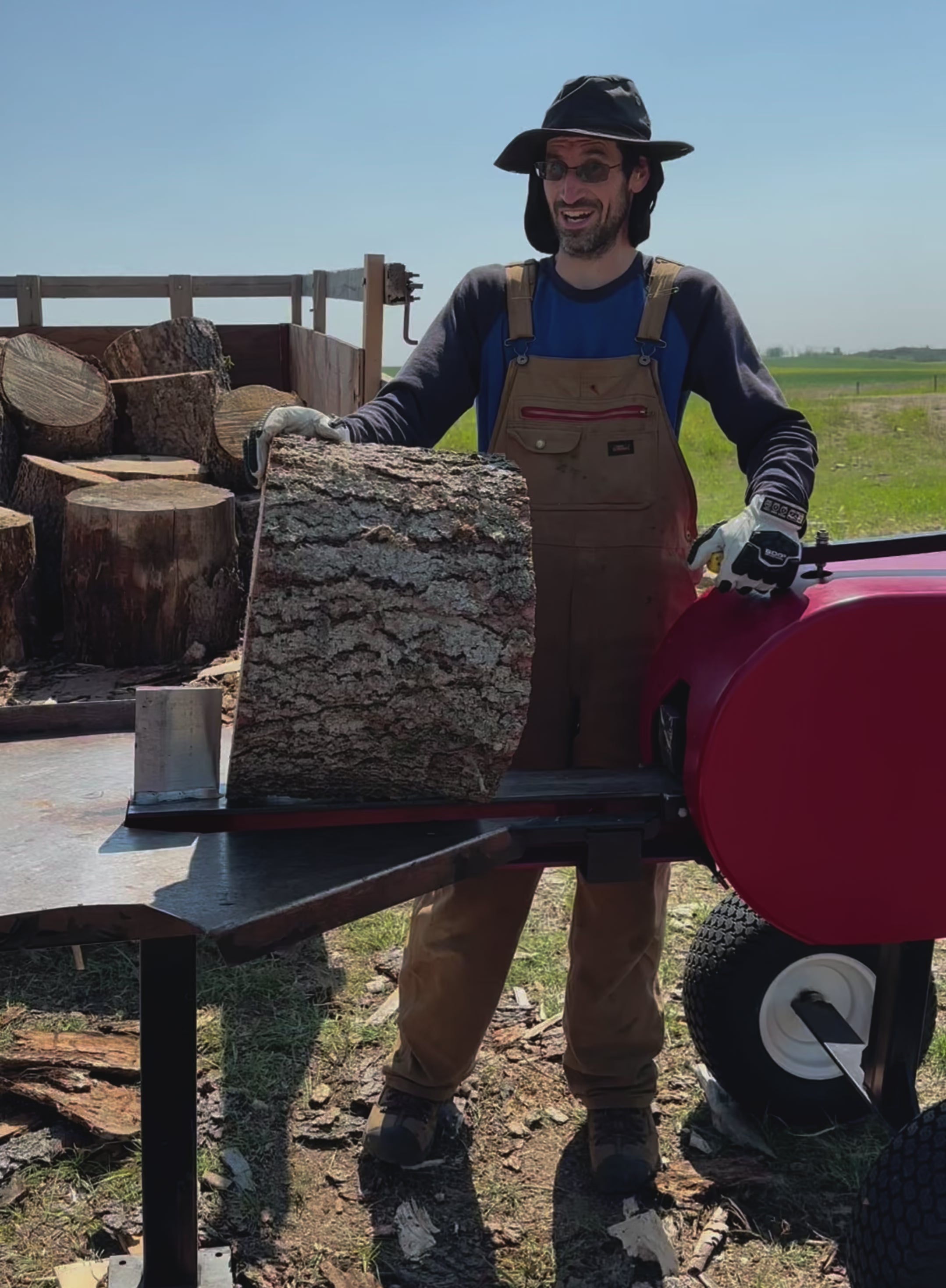 Load video: Splitting big rounds of spruce